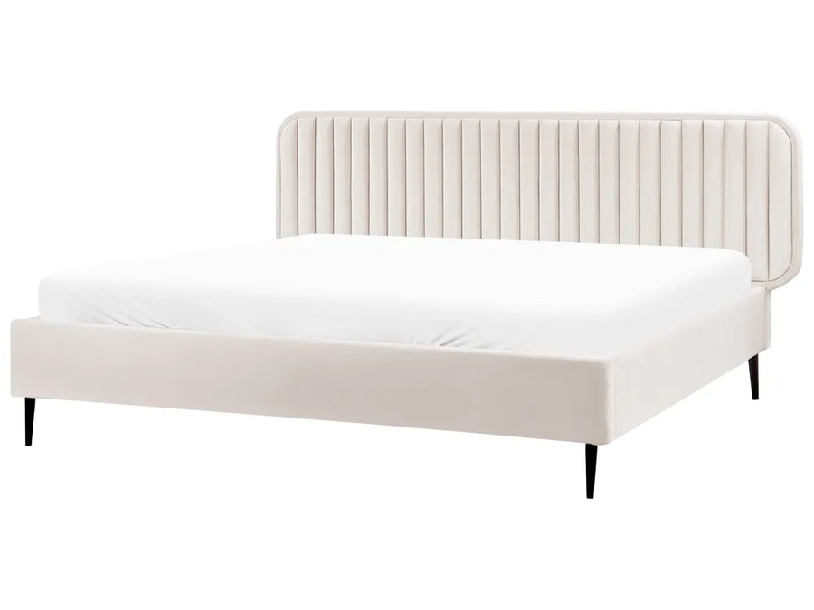 White bed with a ribbed headboard on a white background