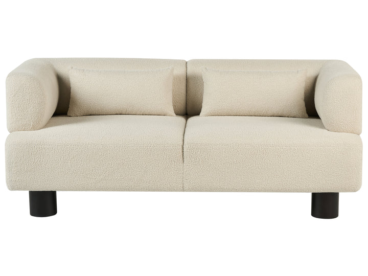 Beige sofa with black legs on a white background
