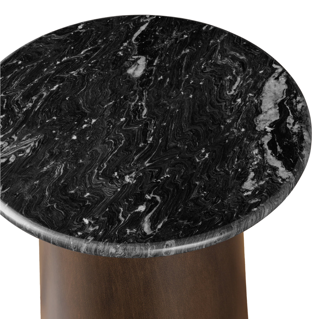 Round marble table with black and white marbled pattern on a white background