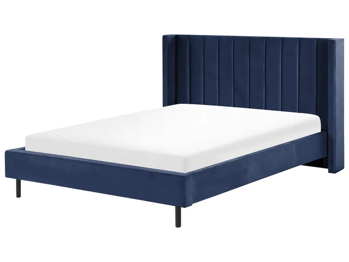 Navy blue bed frame with white mattress on a white background