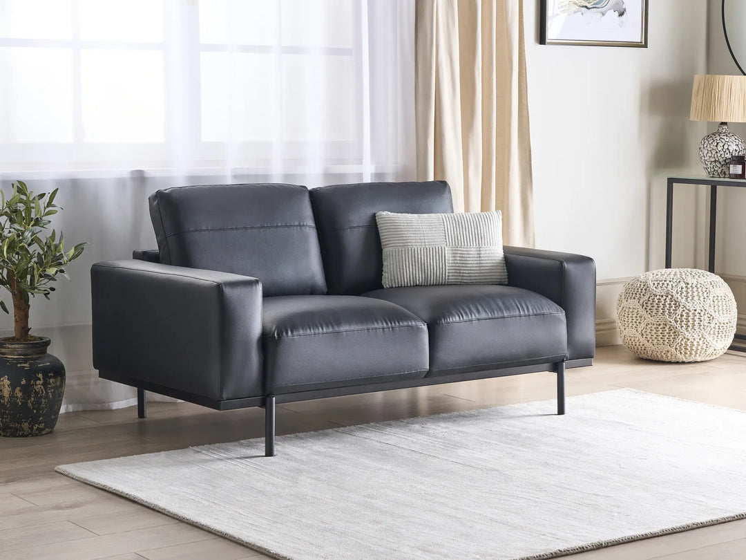 Modern black faux leather loveseat with padded seat and armrests