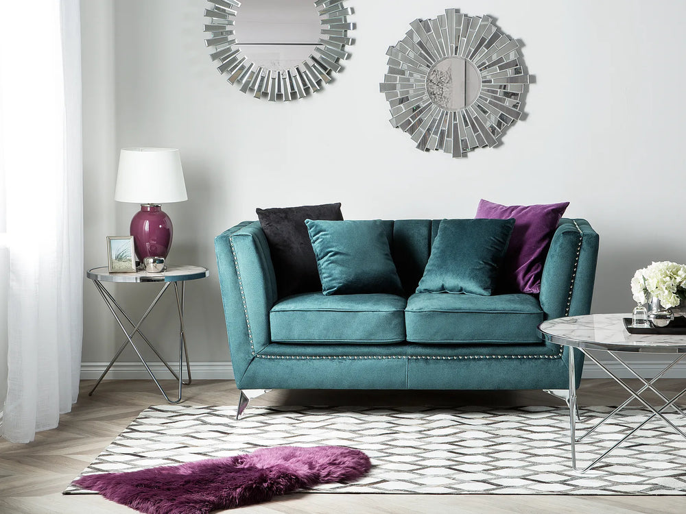 Modern teal velvet loveseat with padded seat and backrest