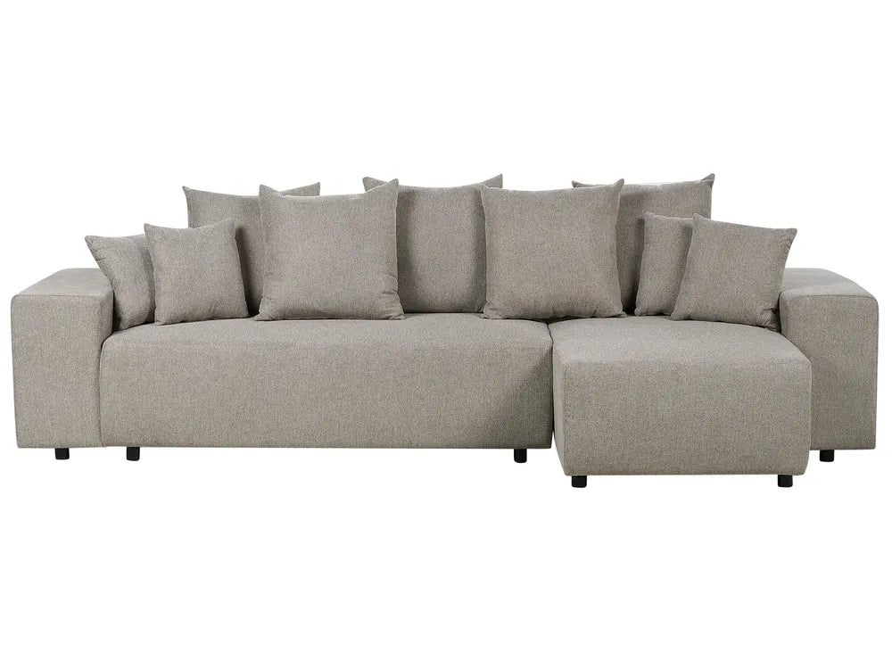 Gray sectional sofa with multiple cushions on a white background