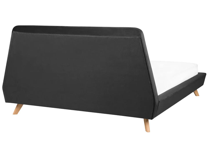 Black bed frame with wooden legs on a white background