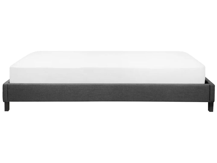 Black bed frame with white mattress on a white background