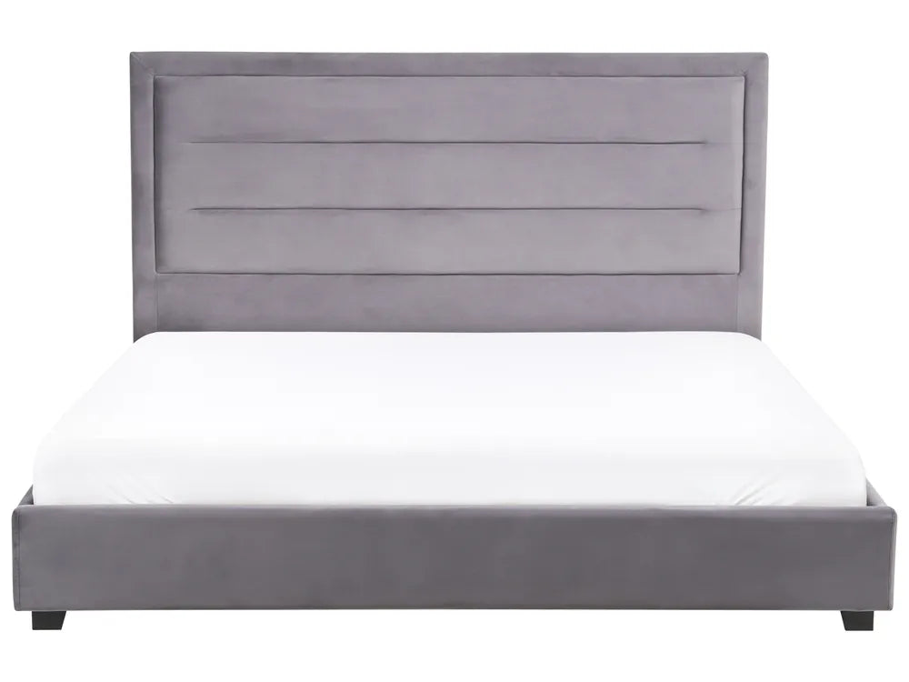 Gray upholstered bed with white mattress on a white background