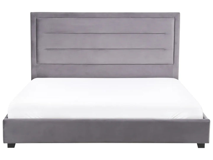 Gray upholstered bed with white mattress on a white background