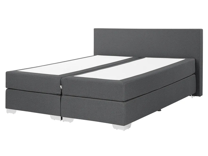 Gray fabric bed frame with white mattress on a white background