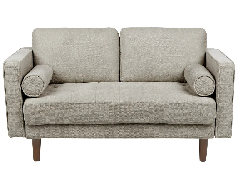 Beige sofa with wooden legs on a white background