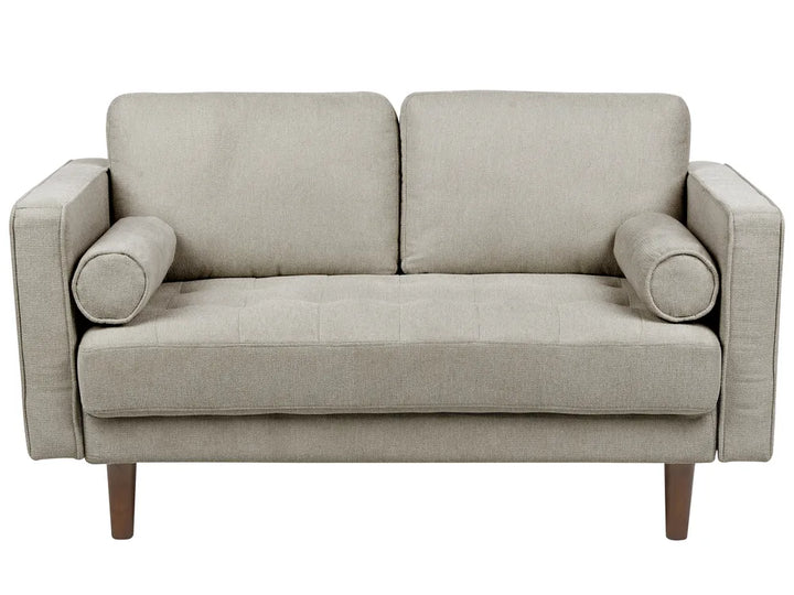 Beige sofa with wooden legs on a white background