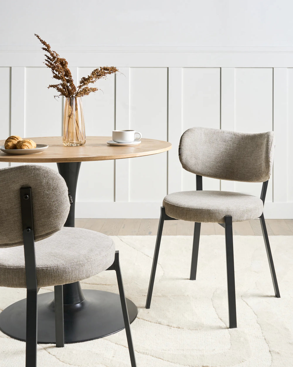 Modern dining setup showcasing soft fabric chairs that combine everyday comfort with a clean, contemporary design.