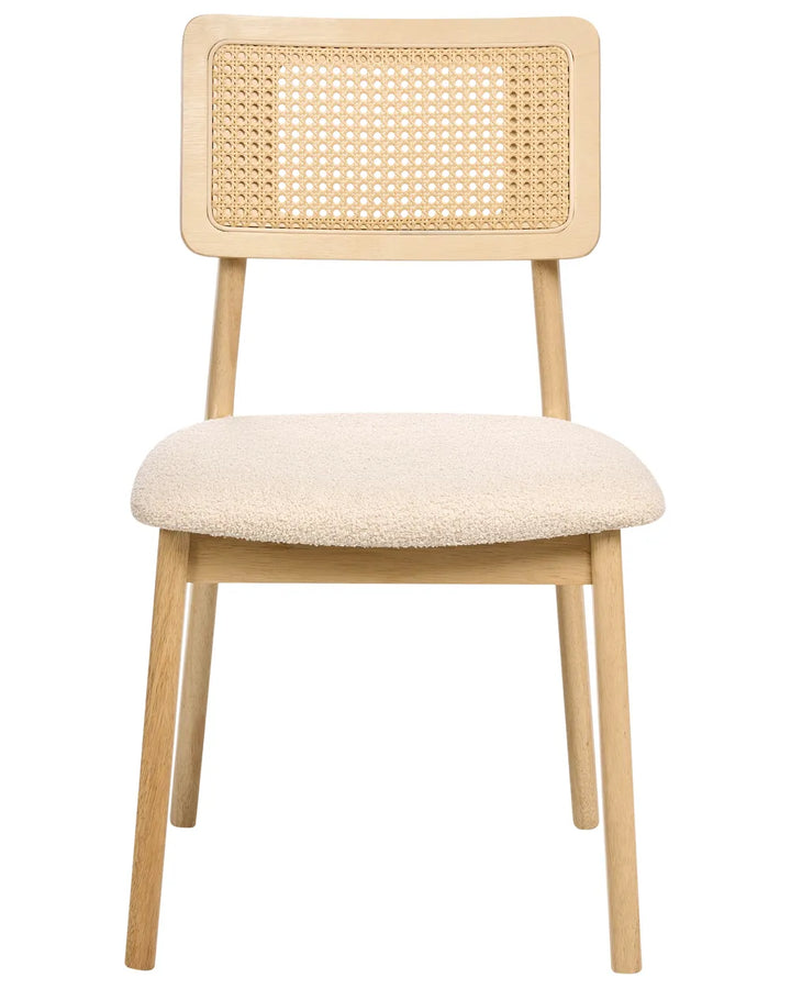 Elegant dining chair featuring a solid wood frame in a light natural finish, paired with a handwoven rattan cane backrest and a plush boucle-upholstered seat. The combination of organic textures and clean lines creates a refined yet relaxed aesthetic, offering both comfort and visual warmth for contemporary, coastal, or Scandinavian-inspired interiors.