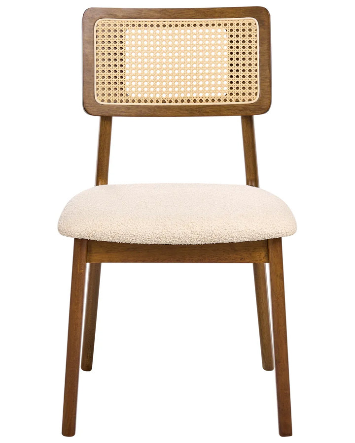 Stylish dining chair crafted from solid wood in a rich walnut finish, featuring a woven rattan cane backrest and a generously padded boucle-upholstered seat. The combination of warm wood tones, natural cane detailing, and soft textured fabric creates an inviting balance of comfort and sophistication, ideal for modern, mid-century, and contemporary interiors.