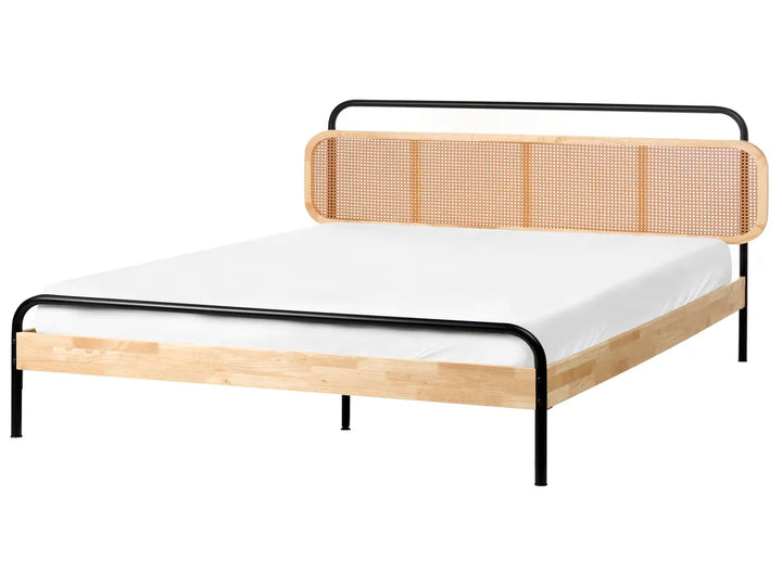 Wooden bed frame with white mattress on a white background