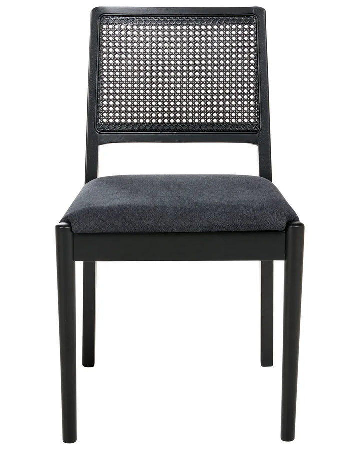 Black dining chair with a woven cane backrest and plush upholstered seat, combining sleek modern lines with timeless natural texture for an elegant, contemporary look.