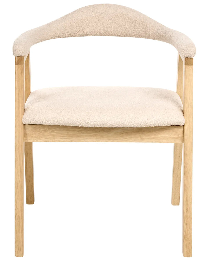 Light wood accent chair with cream boucle upholstery and curved armrests on a white background.