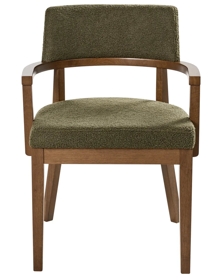 Bouclé dining chair with a curved backrest, wooden armrests, and a warm walnut-finished frame.