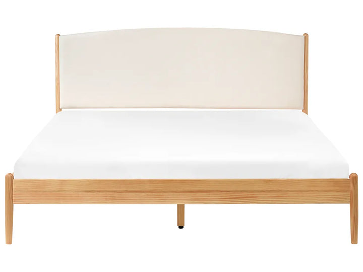 Wooden bed frame with white mattress on a white background