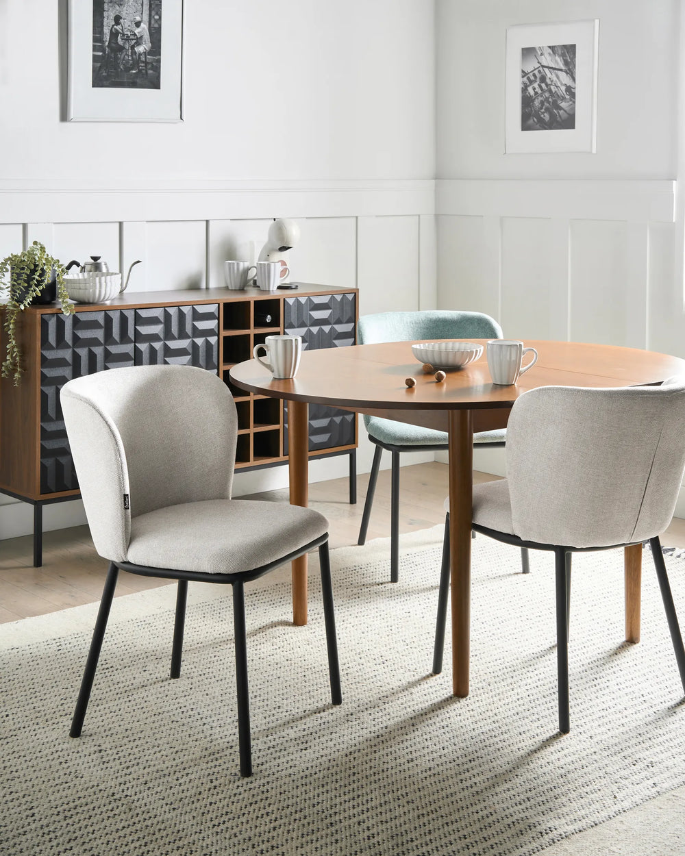 Modern beige dining chairs paired with a wooden table, creating a bright, comfortable, and contemporary dining space.