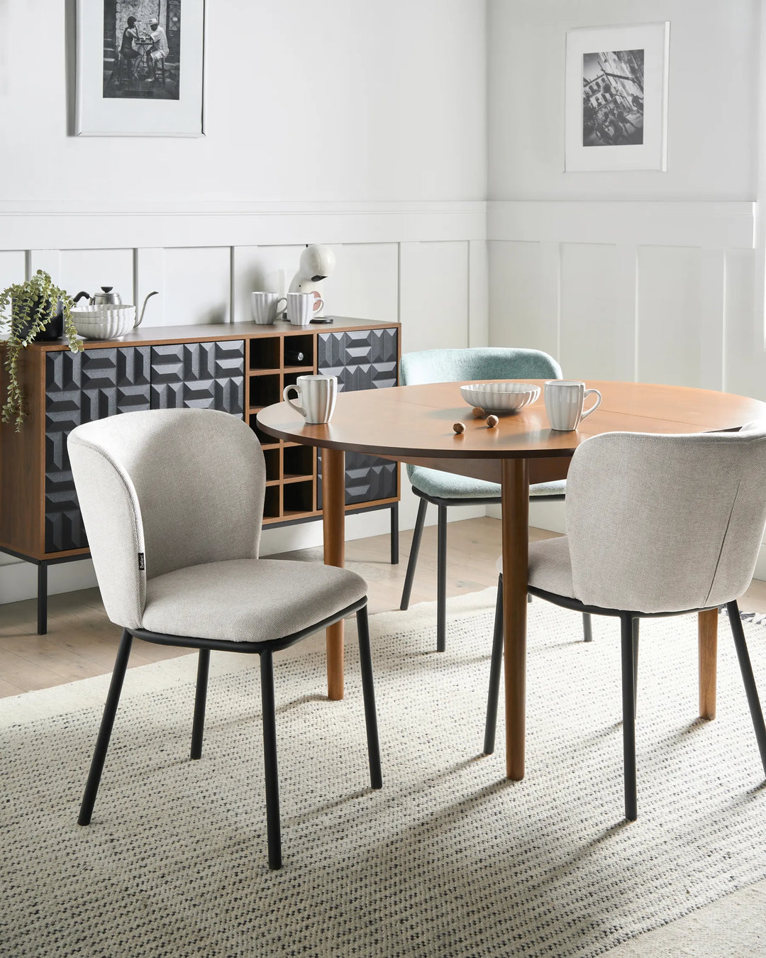 Modern beige dining chairs paired with a wooden table, creating a bright, comfortable, and contemporary dining space.