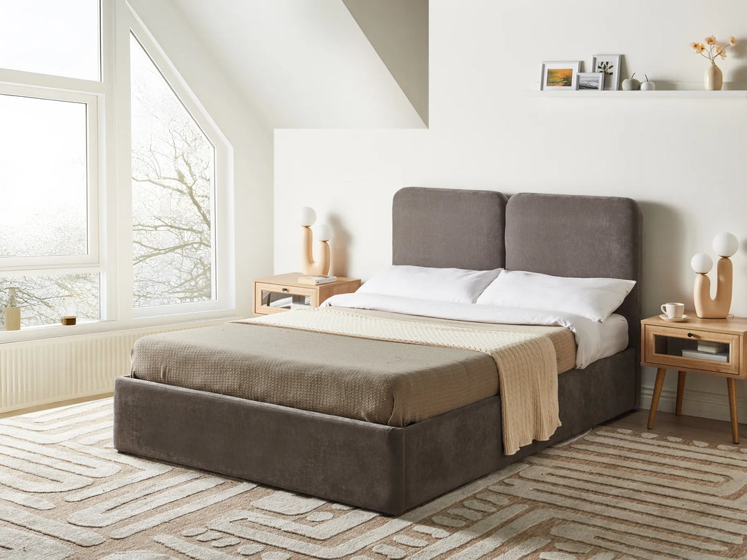 Brown upholstered bed in a modern bedroom 