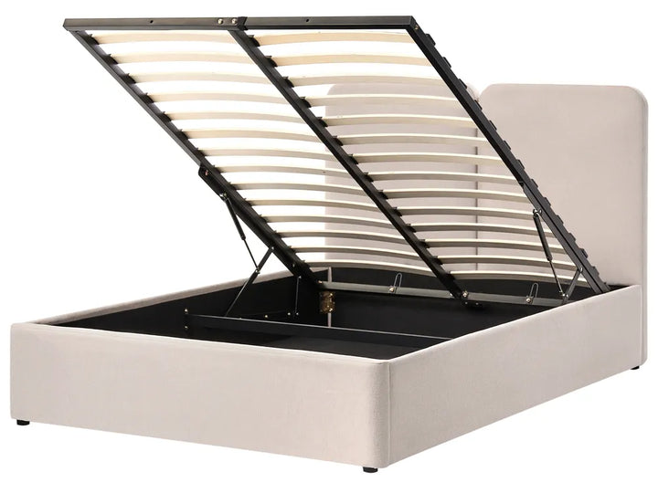 Beige upholstered bed frame with open storage compartment 