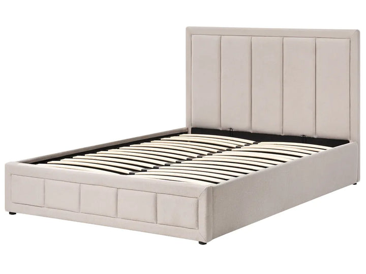 Beige upholstered bed frame on a white background