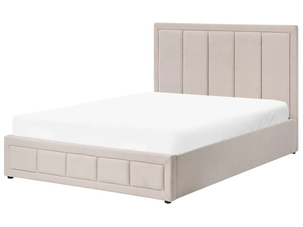 Beige upholstered bed with white mattress on a white background
