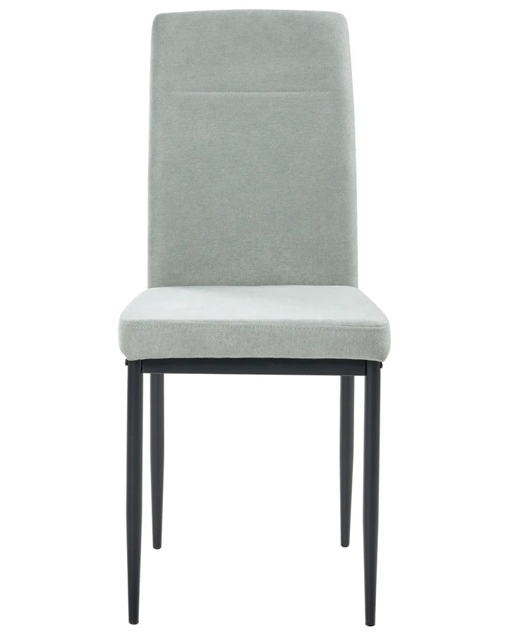 Light green upholstered dining chair with a tall backrest and black metal legs.