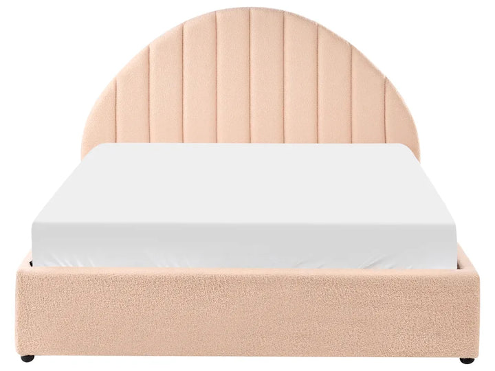Beige upholstered bed with a white mattress on a white background