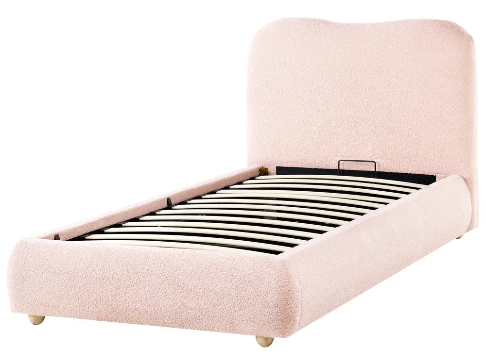Pink upholstered bed frame on a white background