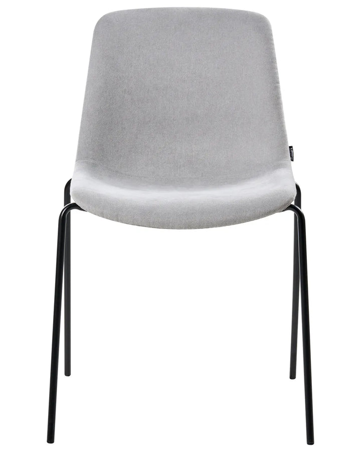 Light grey velvet dining chair with black legs.
