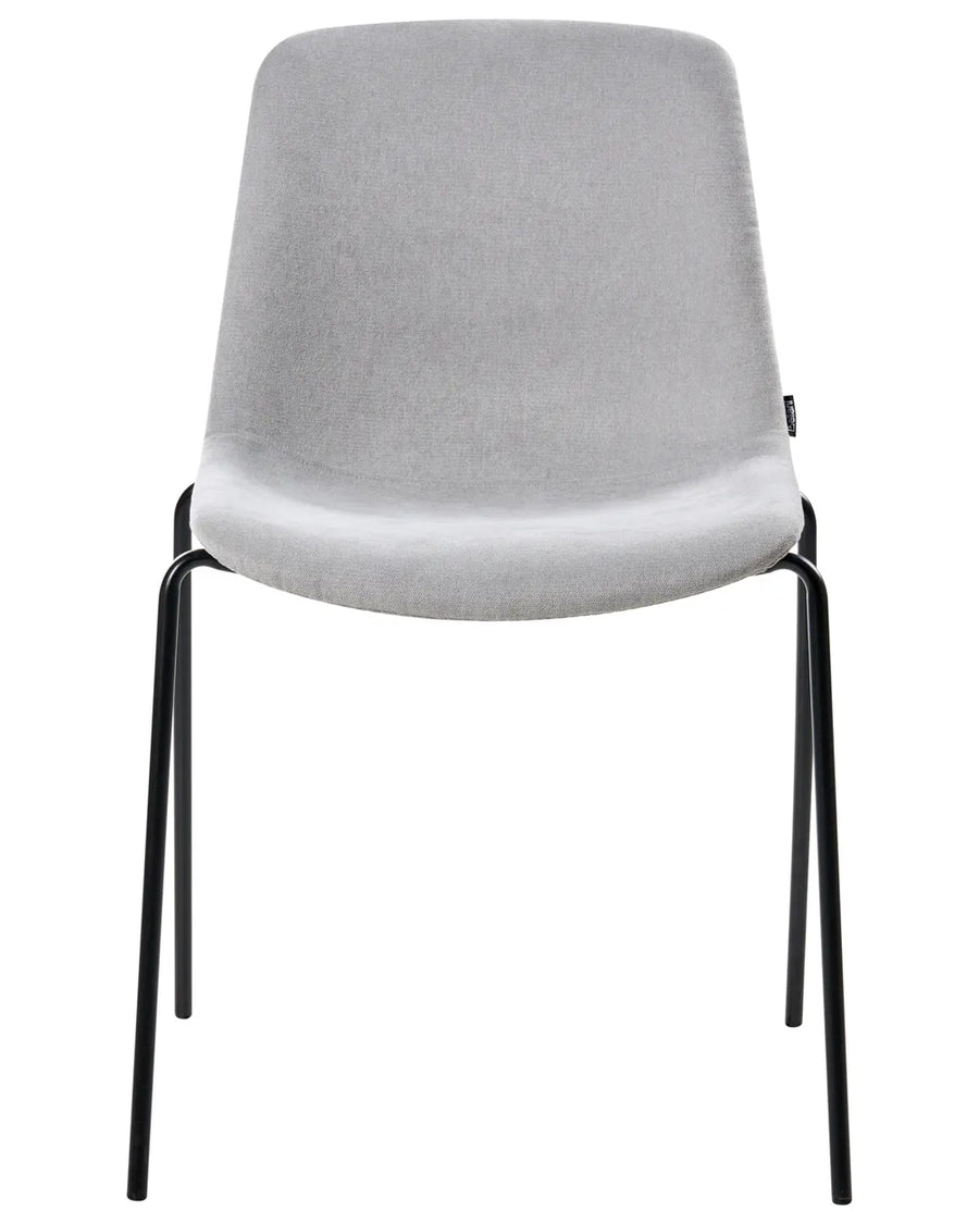 Light grey velvet dining chair with black legs.