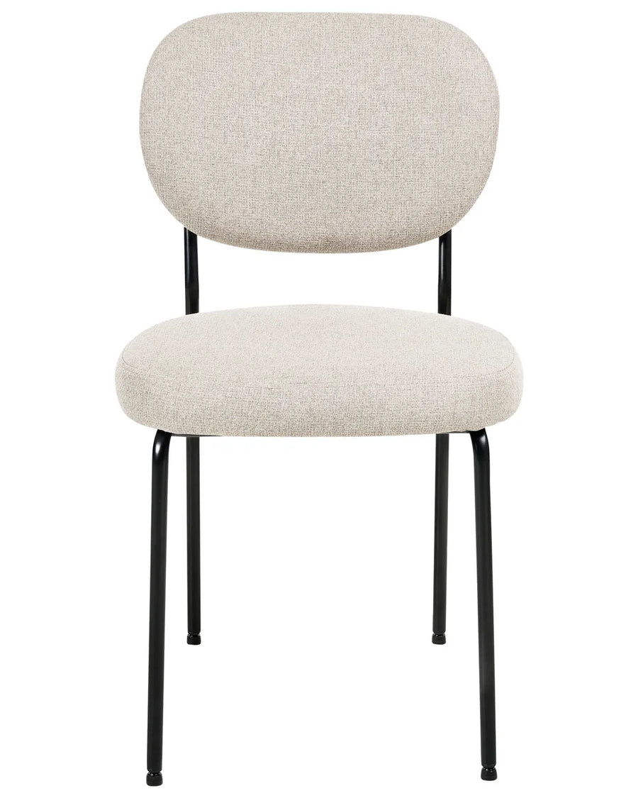 Beige upholstered dining chair with a rounded backrest, generously padded seat, and slim black metal frame, offering comfort with a clean, modern design.