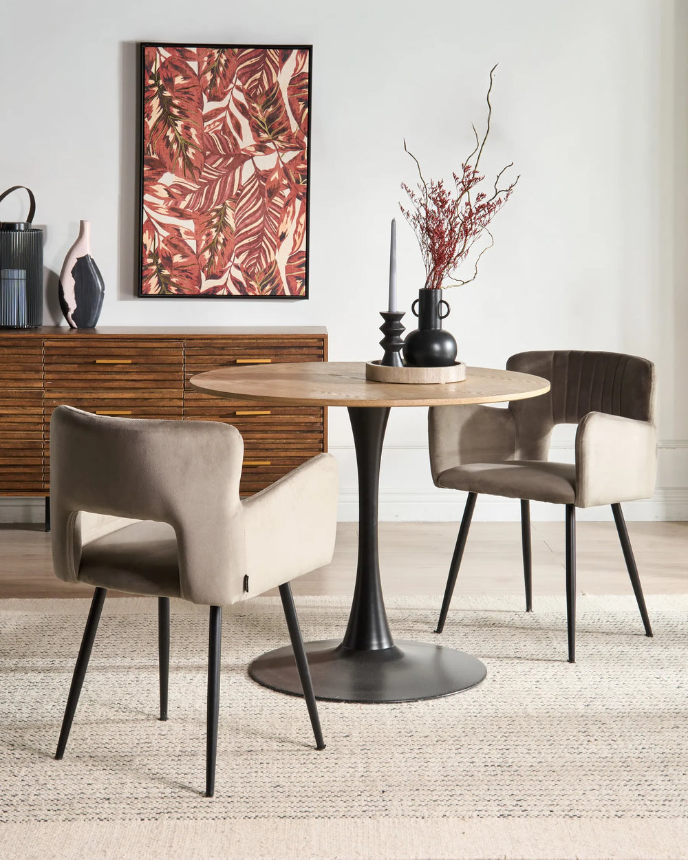 Contemporary dining setting featuring taupe velvet chairs around a round table, creating a warm and sophisticated atmosphere.