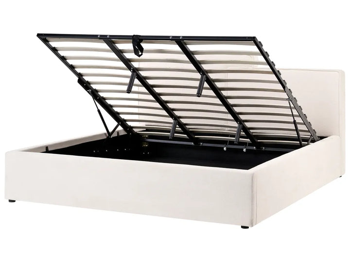 White bed frame with black metal headboard on a white background