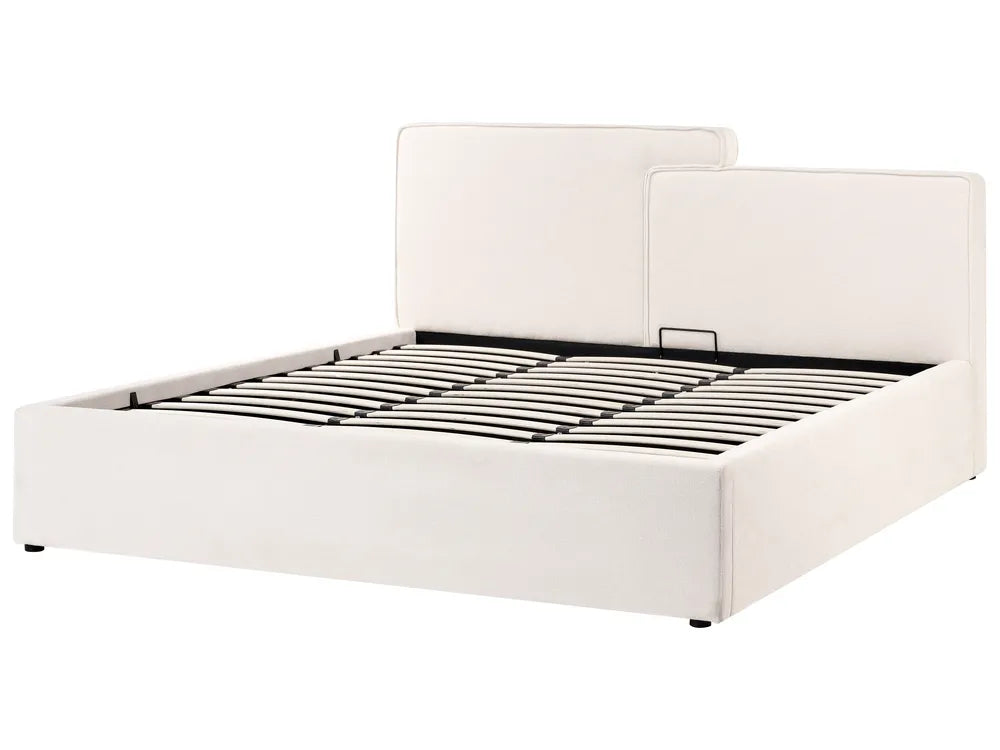 White upholstered bed frame on a white background