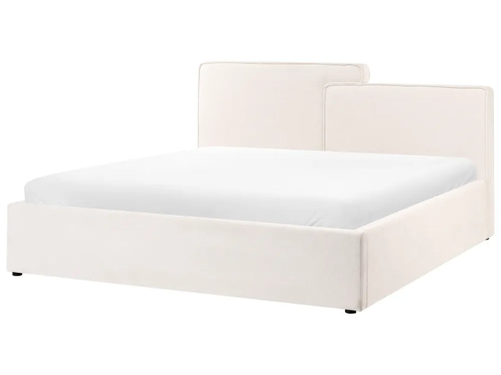 White bed frame with mattress on a white background