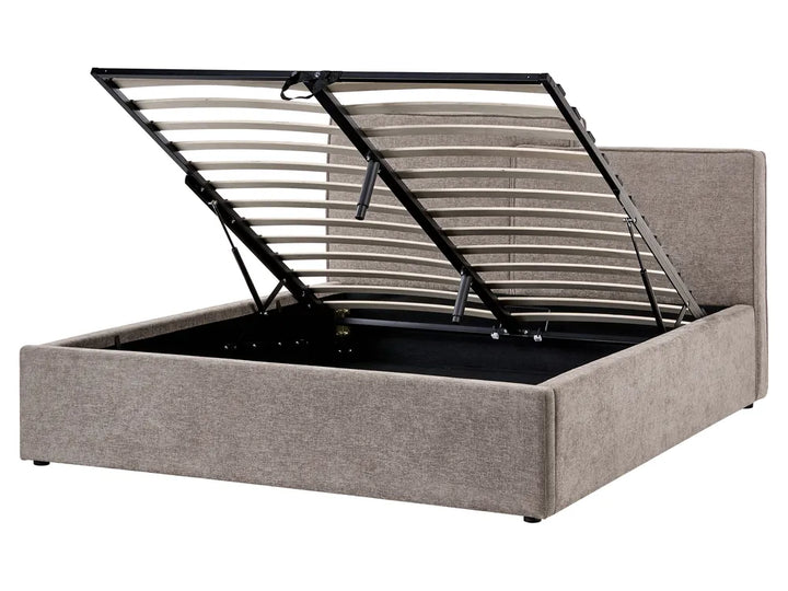 Gray upholstered bed with metal frame on a white background