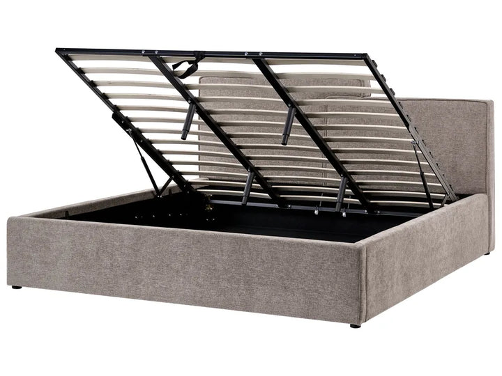 Gray upholstered bed frame with metal slat support on a white background