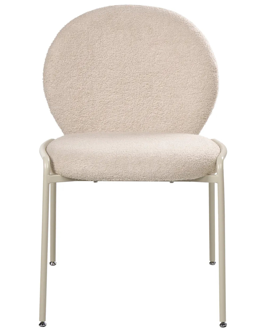 Light beige boucle upholstered dining chair featuring a curved backrest and slim, black powder-coated metal legs.