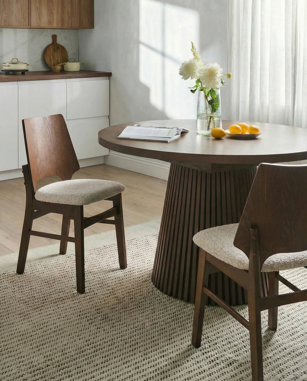 Showcased in a warm, inviting dining space, this accent chair brings depth and elegance through its dark wood tones and textured upholstery. The clean lines and refined profile complement modern, mid-century, and contemporary interiors, while the cushioned seat provides everyday comfort for dining, entertaining, or casual gatherings.