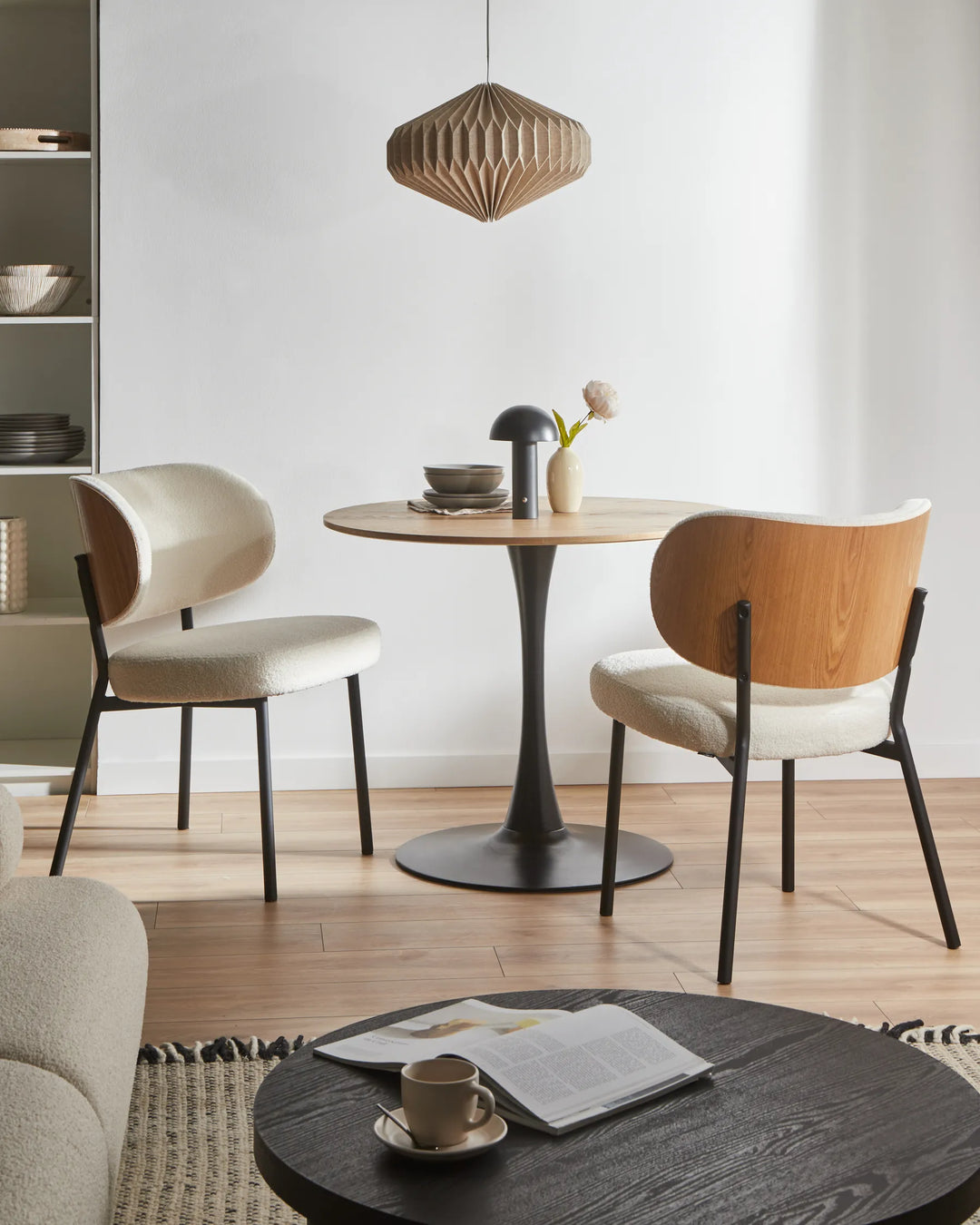 Contemporary dining space showcasing the boucle chair’s warm wood accent back, minimalist design, and cozy Scandinavian-inspired style.