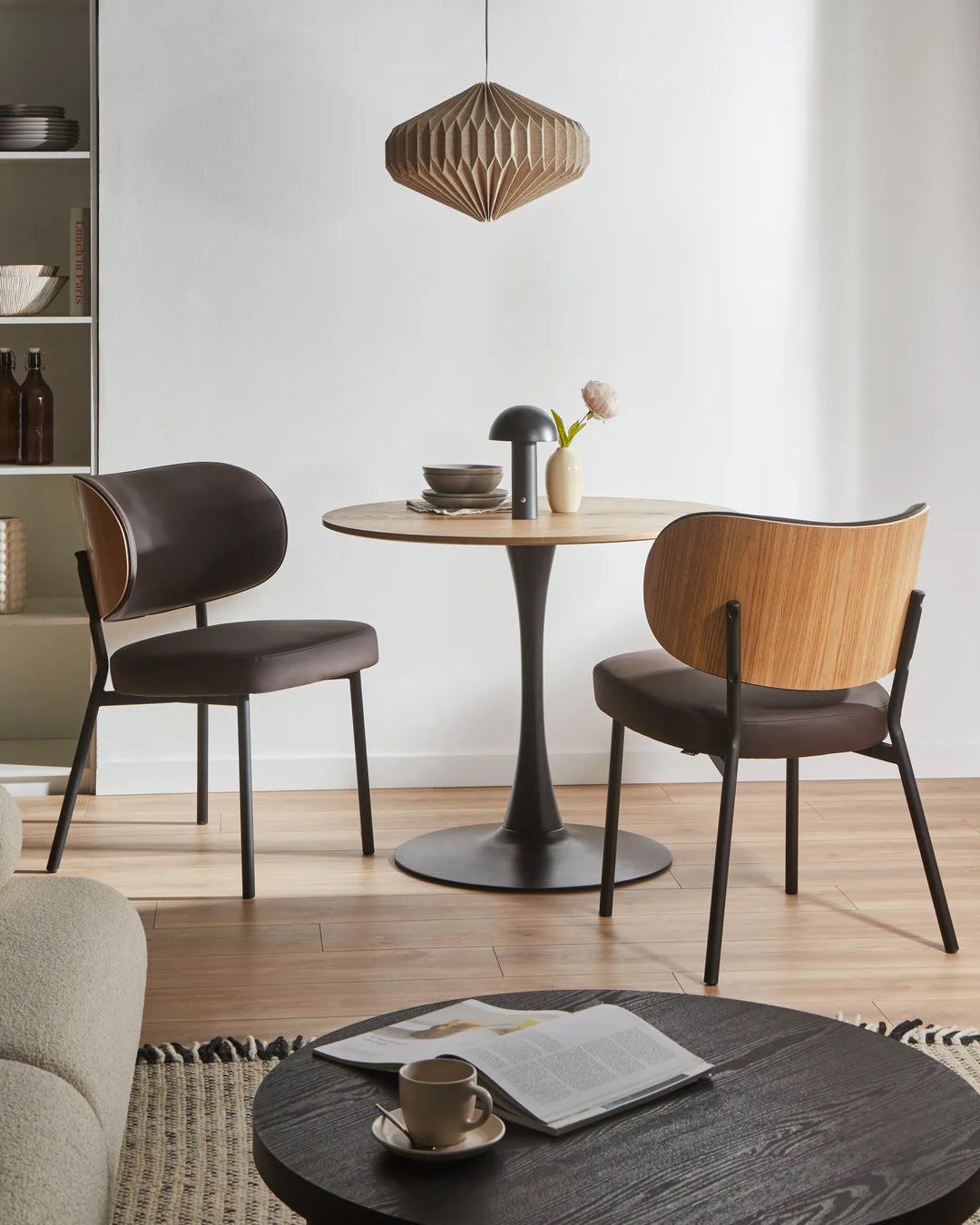 Modern dining nook showcasing the chair’s warm wood accent back, sleek silhouette, and minimalist Scandinavian-inspired design.