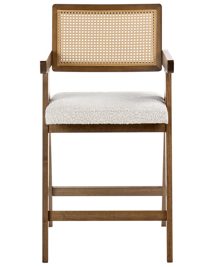 Dark wood bar chair with woven cane backrest and cream upholstered seat on a white background.