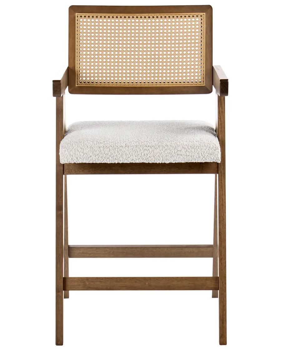 Dark wood bar chair with woven cane backrest and cream upholstered seat on a white background.