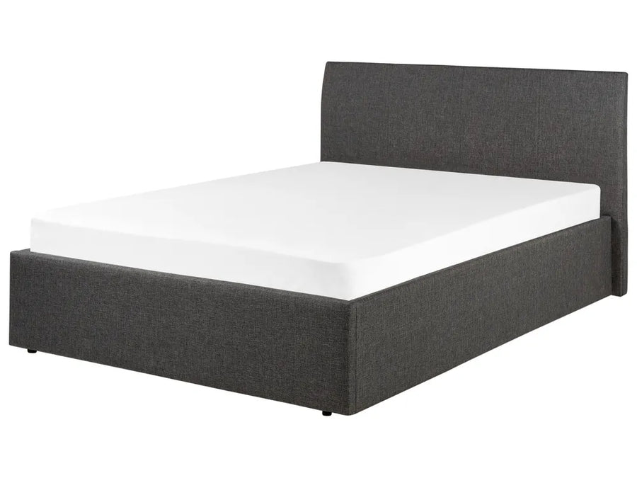 Dark grey upholstered bed with white mattress