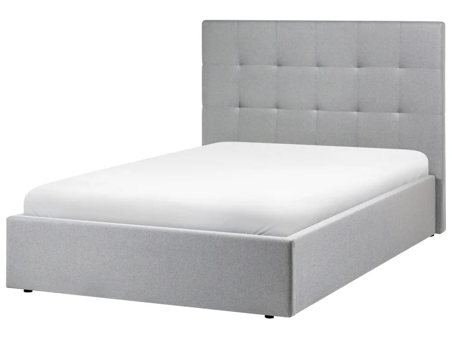 Grey upholstered bed with tufted headboard 