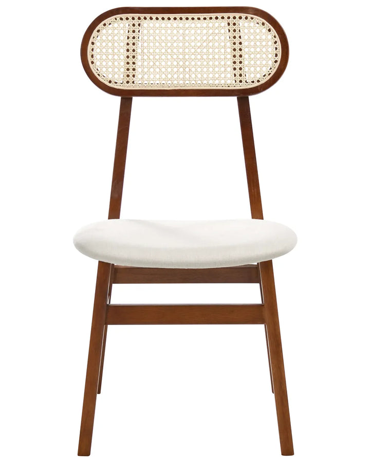 Dark walnut wood dining chair with an oval cane backrest, soft cream upholstered seat, and slim tapered legs, displayed against a clean white background.