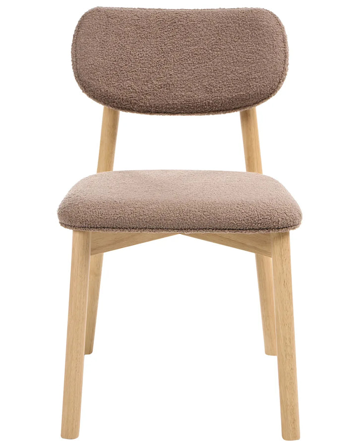 Bouclé dining chair with a rounded backrest, padded seat, and natural wood legs, offering a soft and contemporary look.